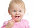 /album/fotogaleria-o-nas1/a3446861-746656-baby-cleaning-teeth-and-smiling-isolated-on-white-background-jpg/